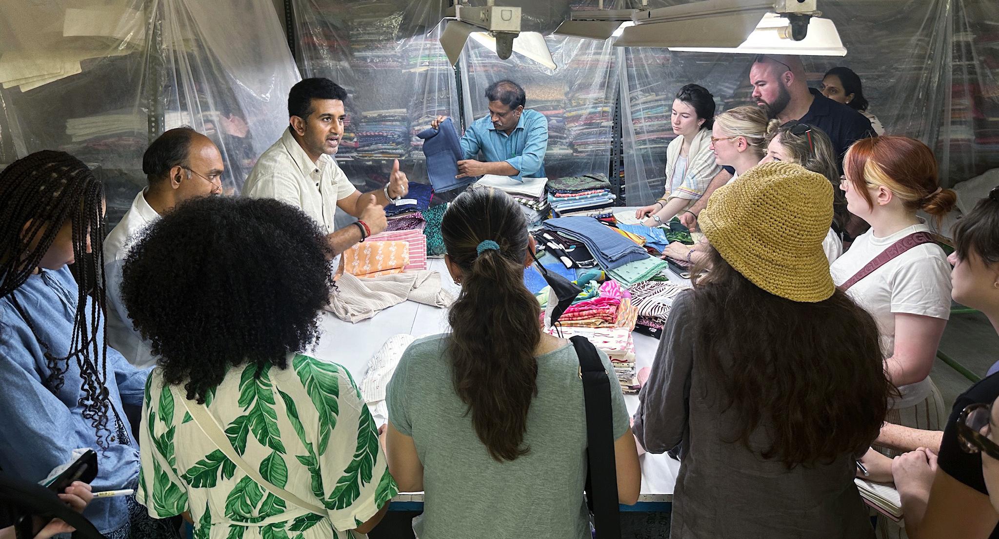 Students learn from a textile manufacturer