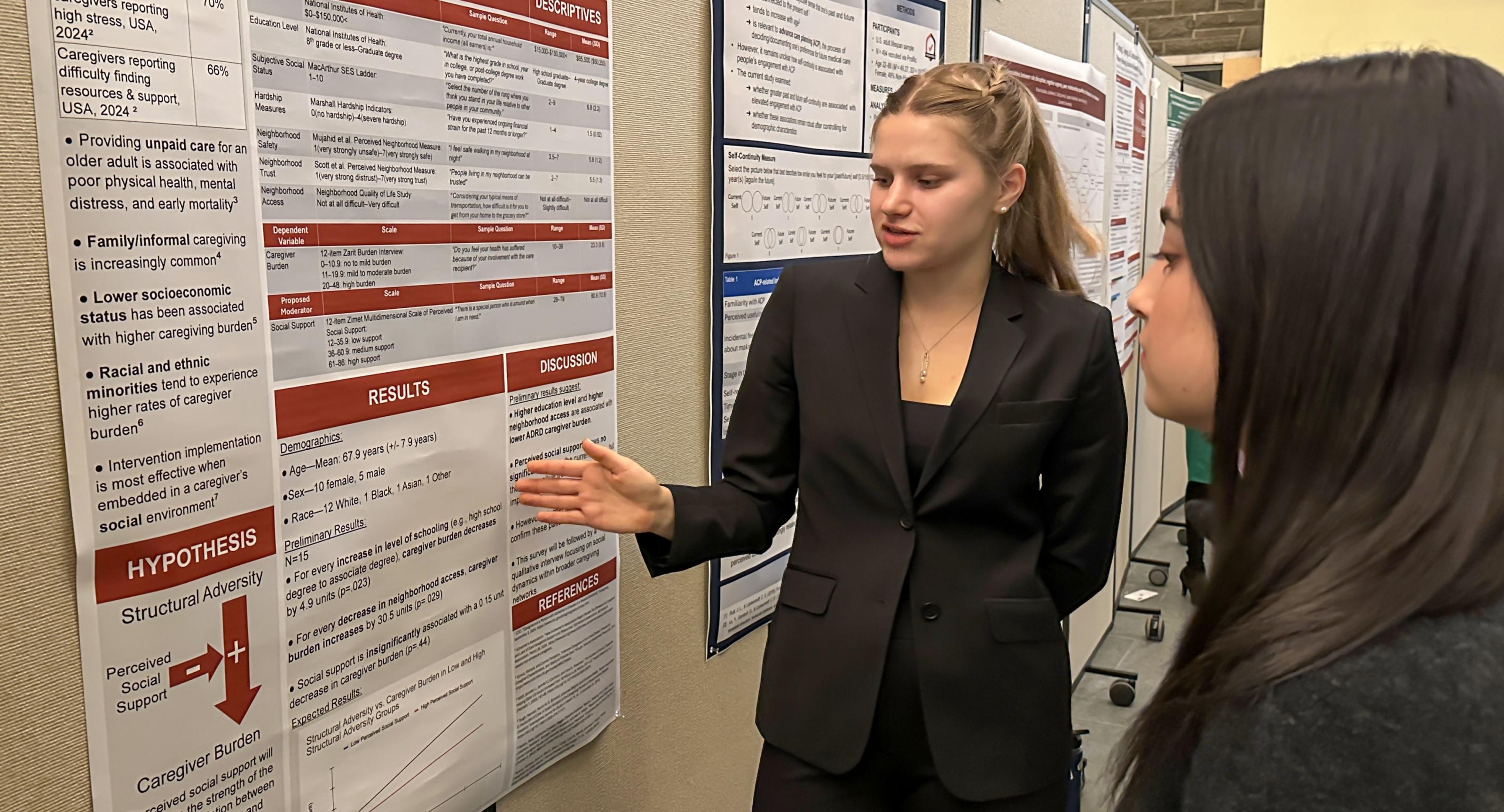 Elizabeth Aldous presenting her research poster