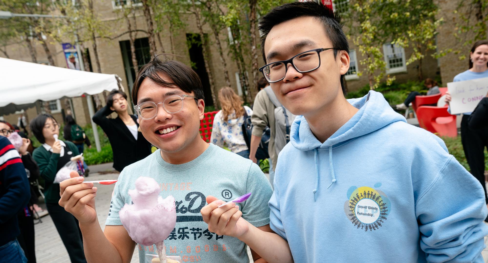 Wells Lee with a friend enjoying ice cream at the CHE BBQ