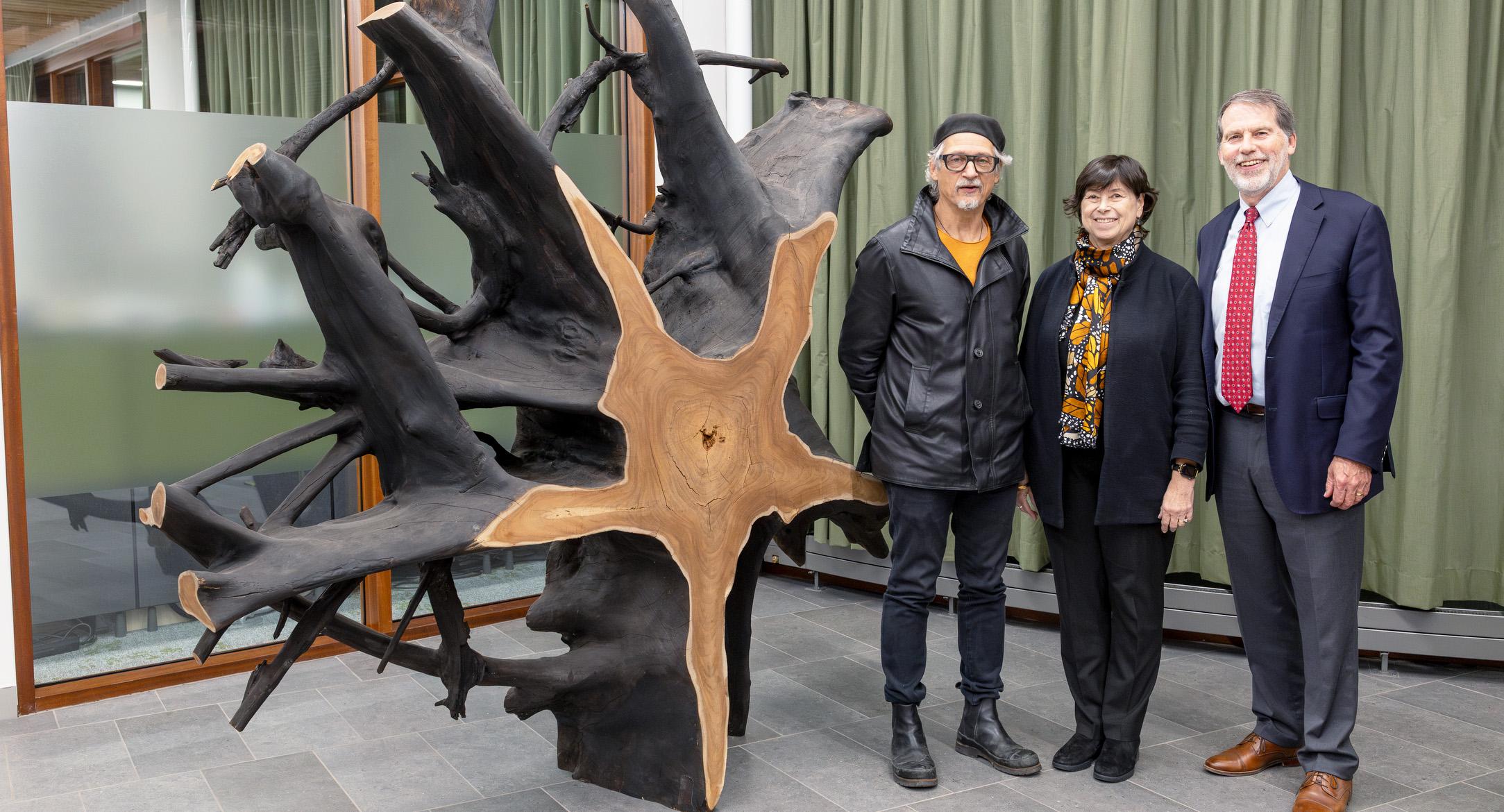 Elliott and 2 others pose with an arborwork sculpture