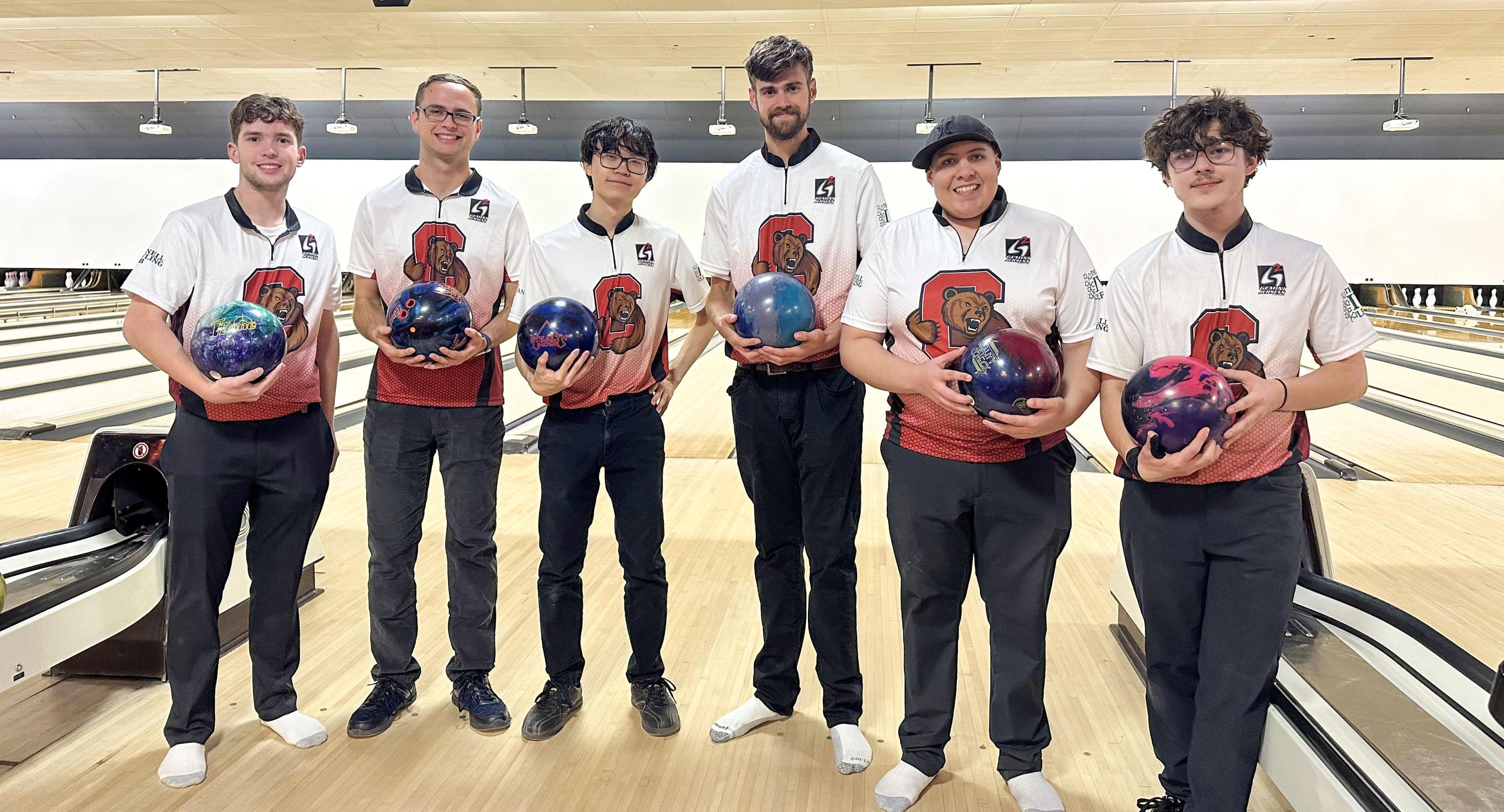 Wells Lee holding a bowling ball alongside fellow members of the Cornell Bowling League