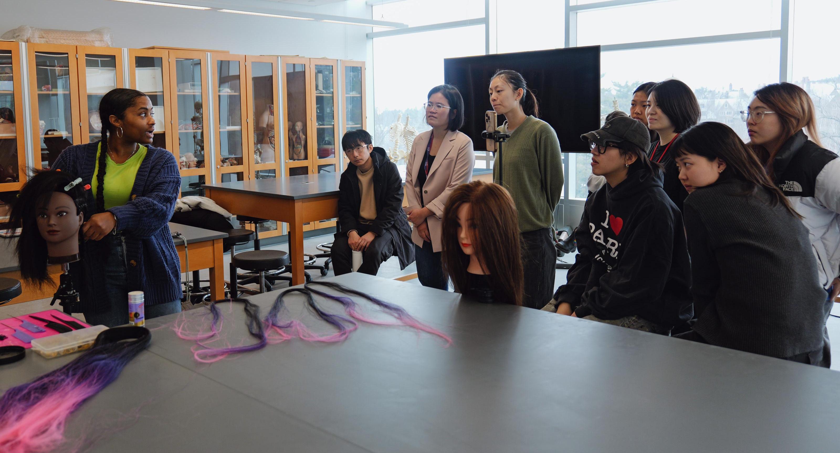Lauren Hooks leads a skill share for the Hybrid Body Lab staff.