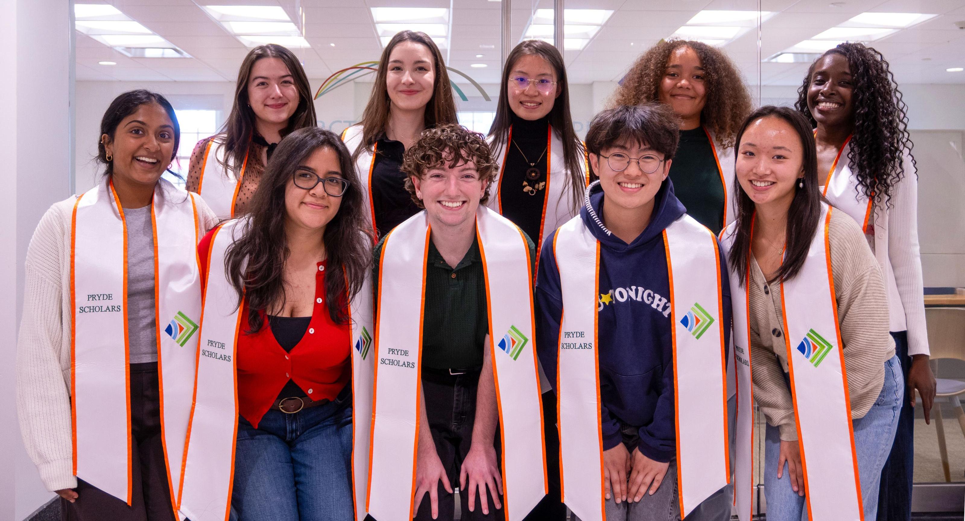 Oore with graduating seniors in PRYDE