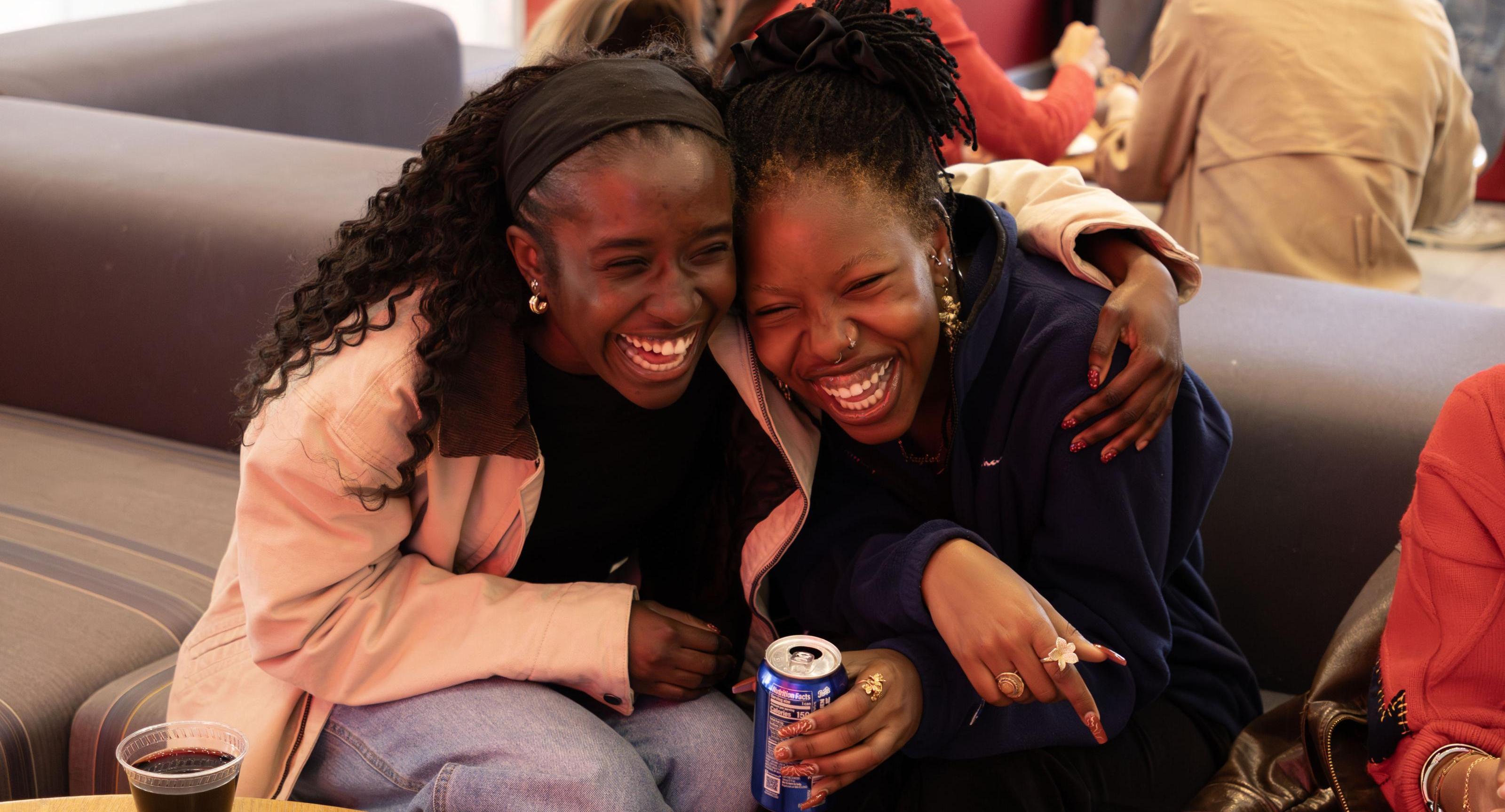 Oore embracing a friend at the CHE Senior Celebration