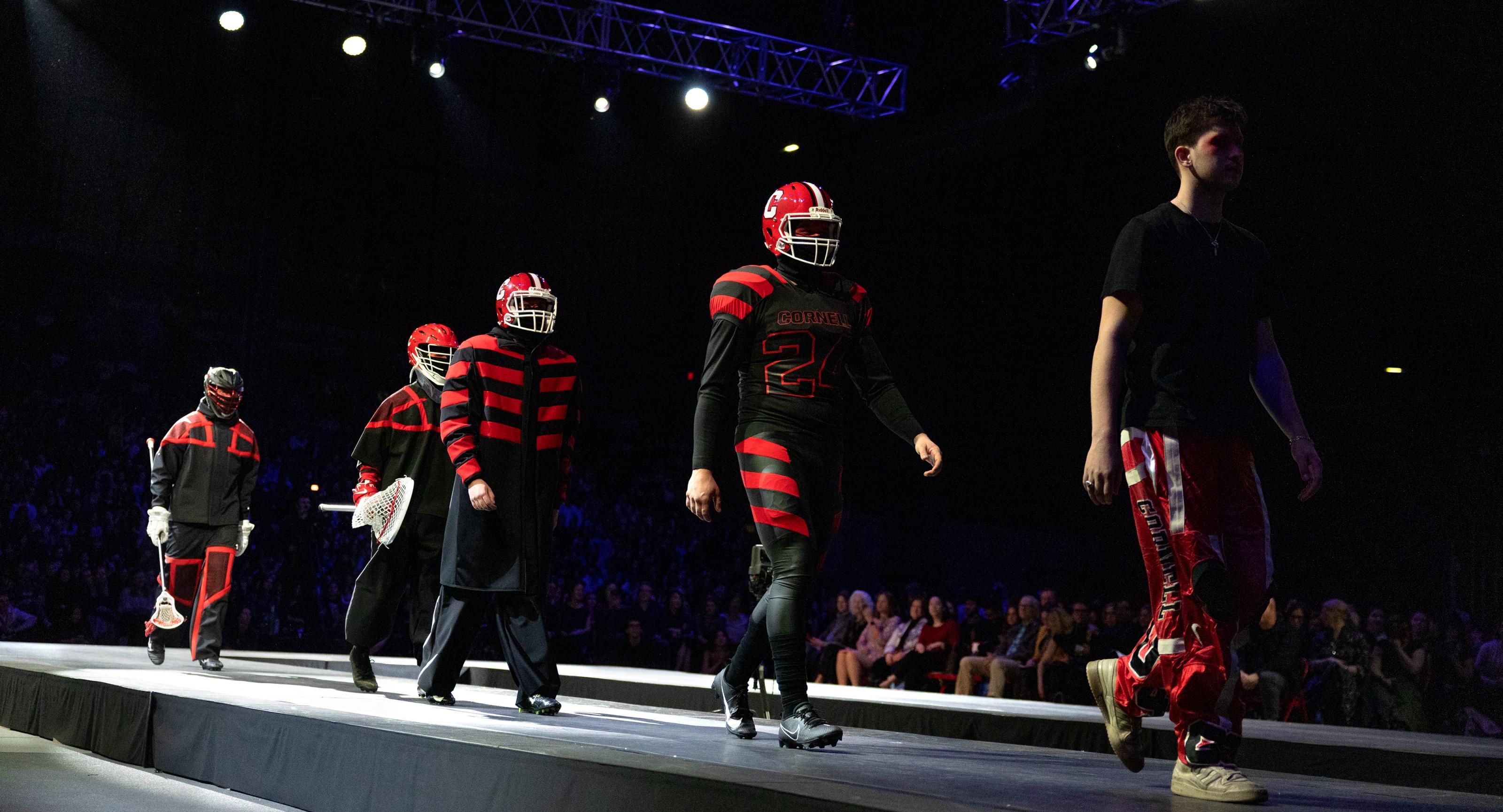 Decorative image: Beckett fine on runway with 4 models wearing red and black Cornell sports uniforms.