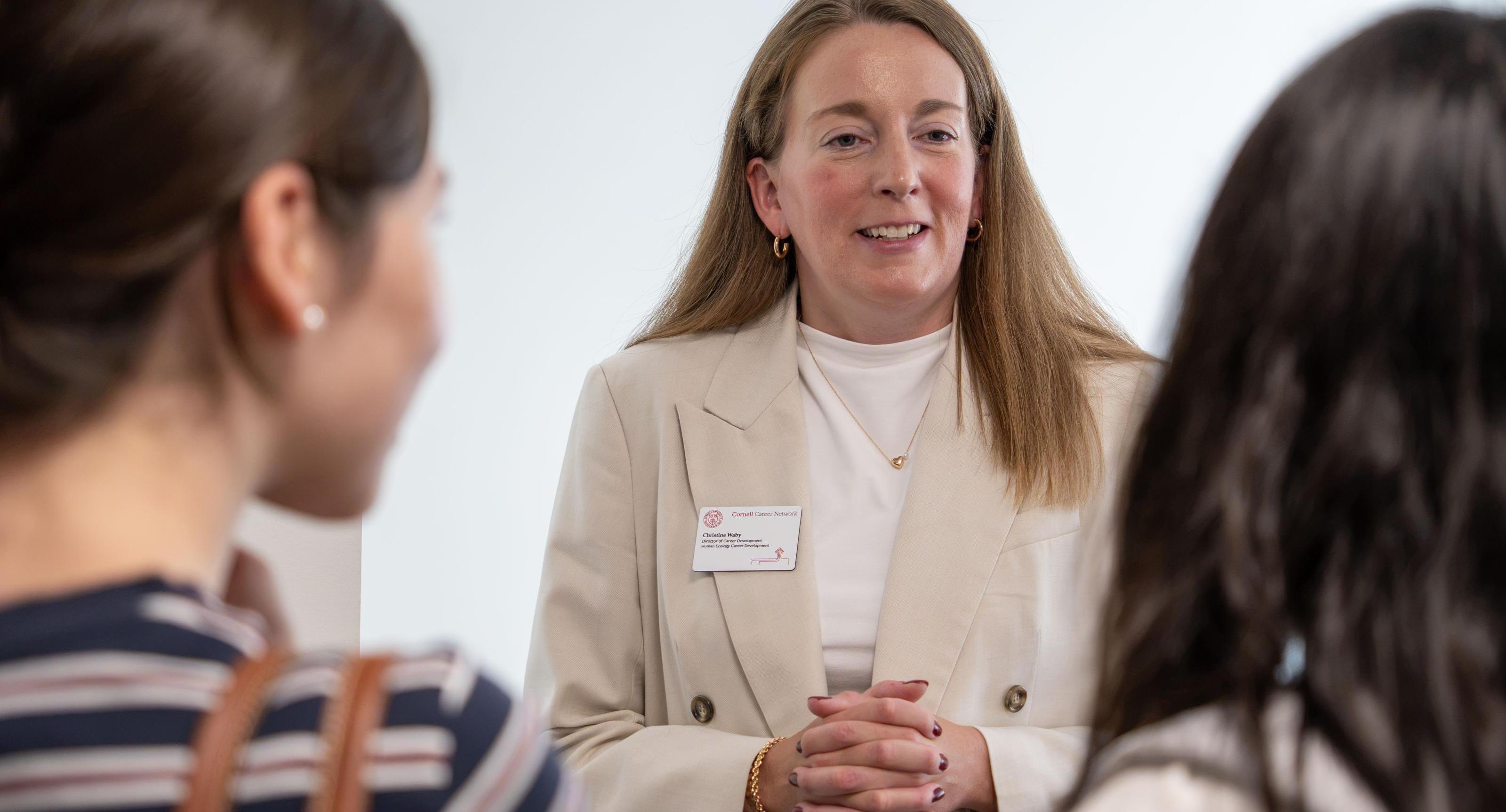 Christine Waby talks with students
