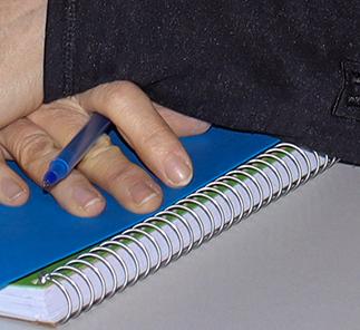woman in an office with a city skyline behind her