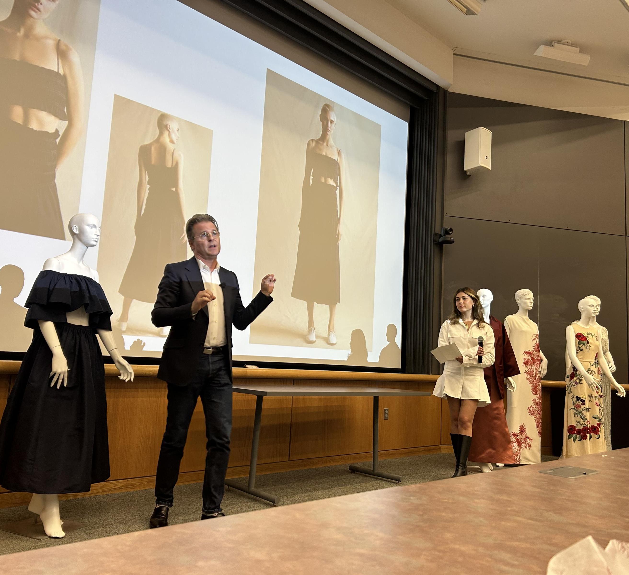 Adam Lippes ’95 presenting with pieces from his company's collection on display 
