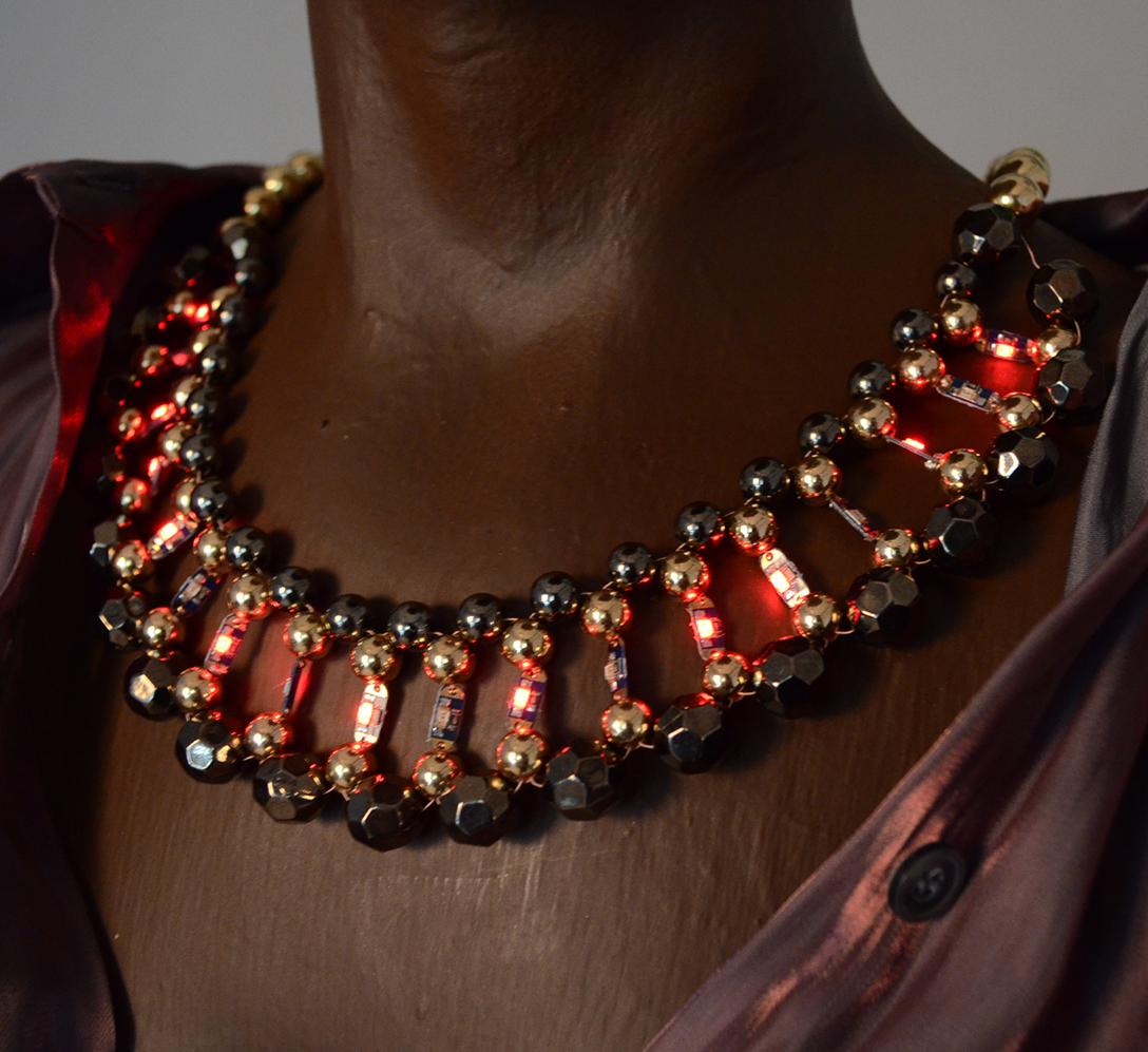 Illuminated necklace on black mennequin
