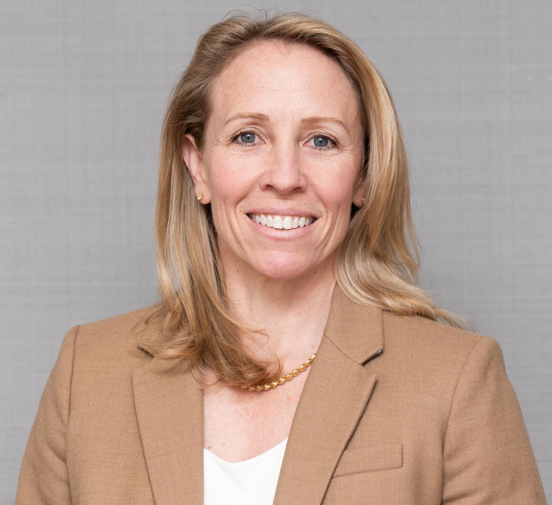 woman in a tan blazer