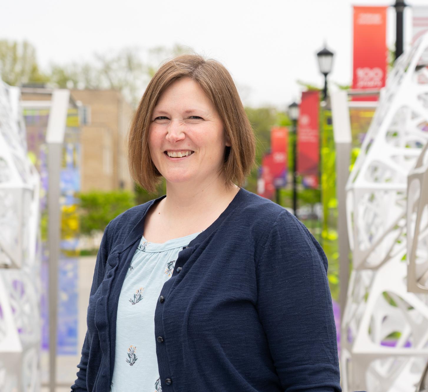 Alexa Maille stands in the Polyform outside Martha Van Rensselar Hall at Cornell.