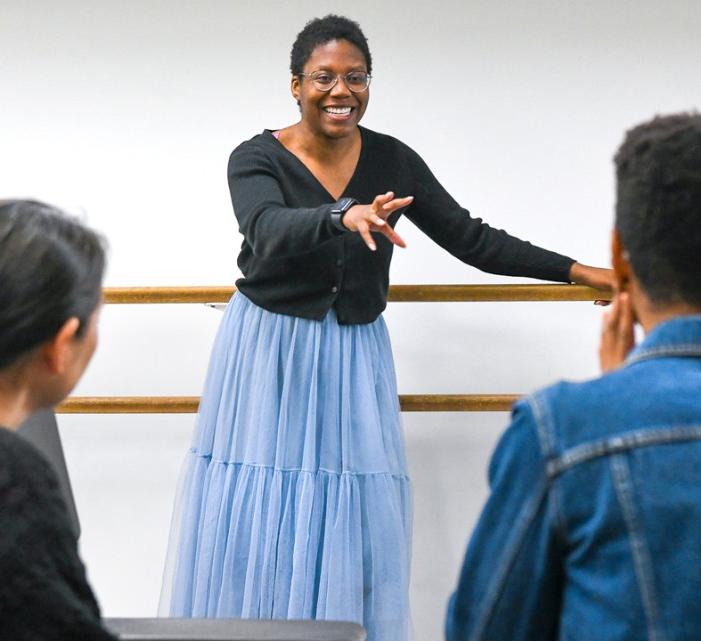 Carly Robinson directs students in the ensemble
