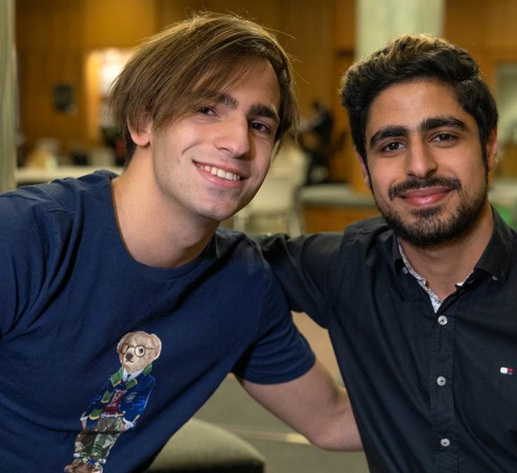 Two students pose for the camera 