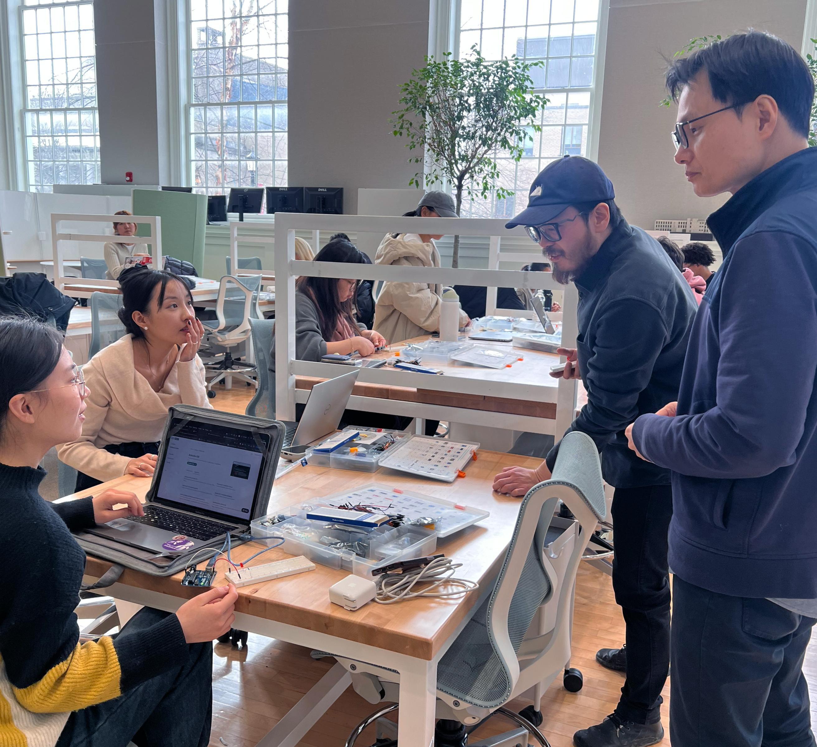 students and faculty work on designs in MVR 1101