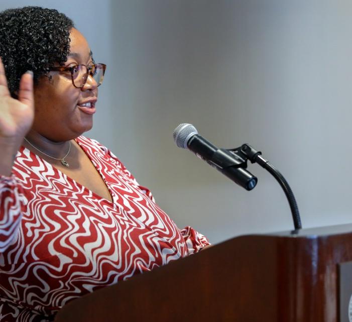 Misha Innis-Thompson speaks to a crowd in the Statler Ballroom