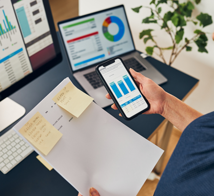 Person multitasking with computers 