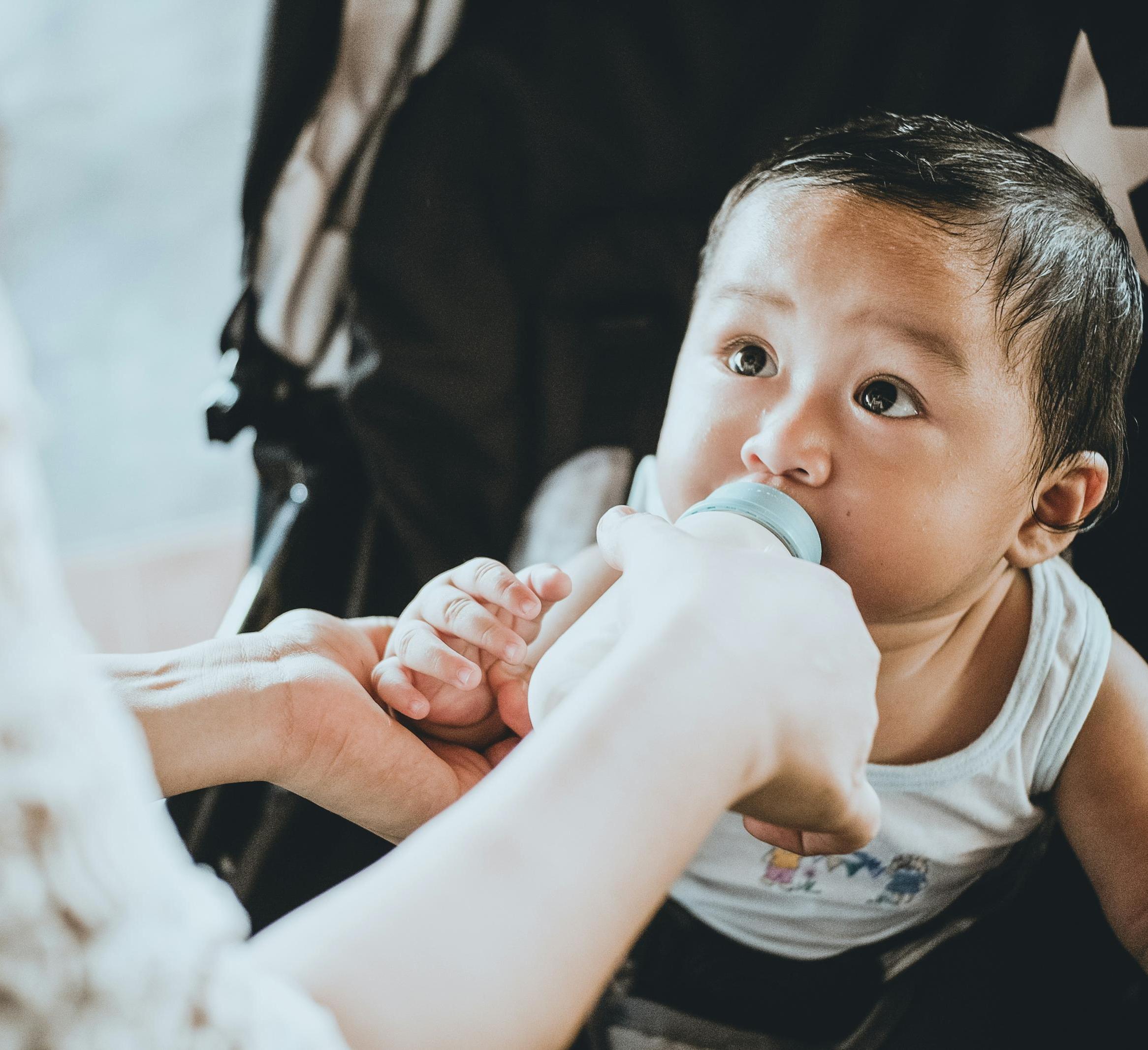 Baby drinking from a bottle 