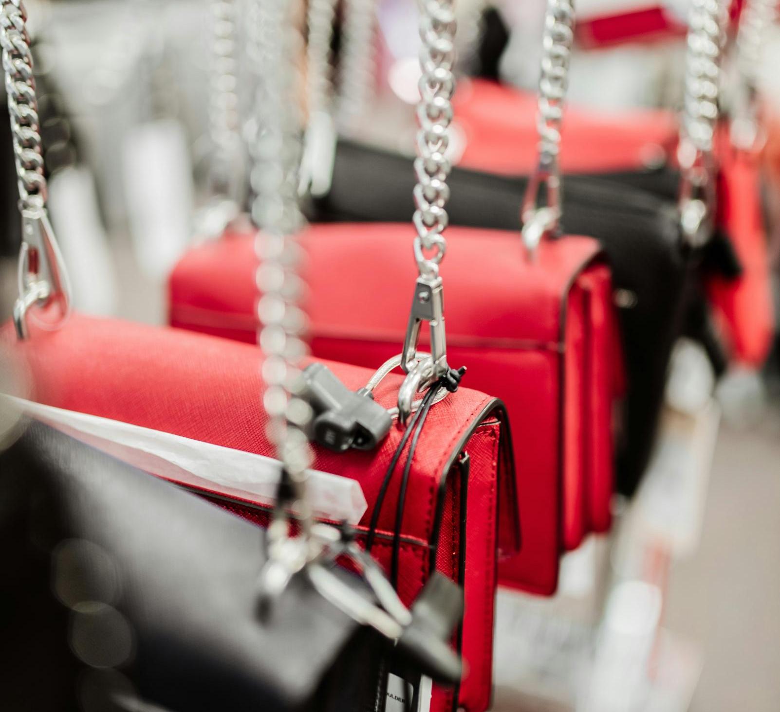 red and black handbags with metal handles
