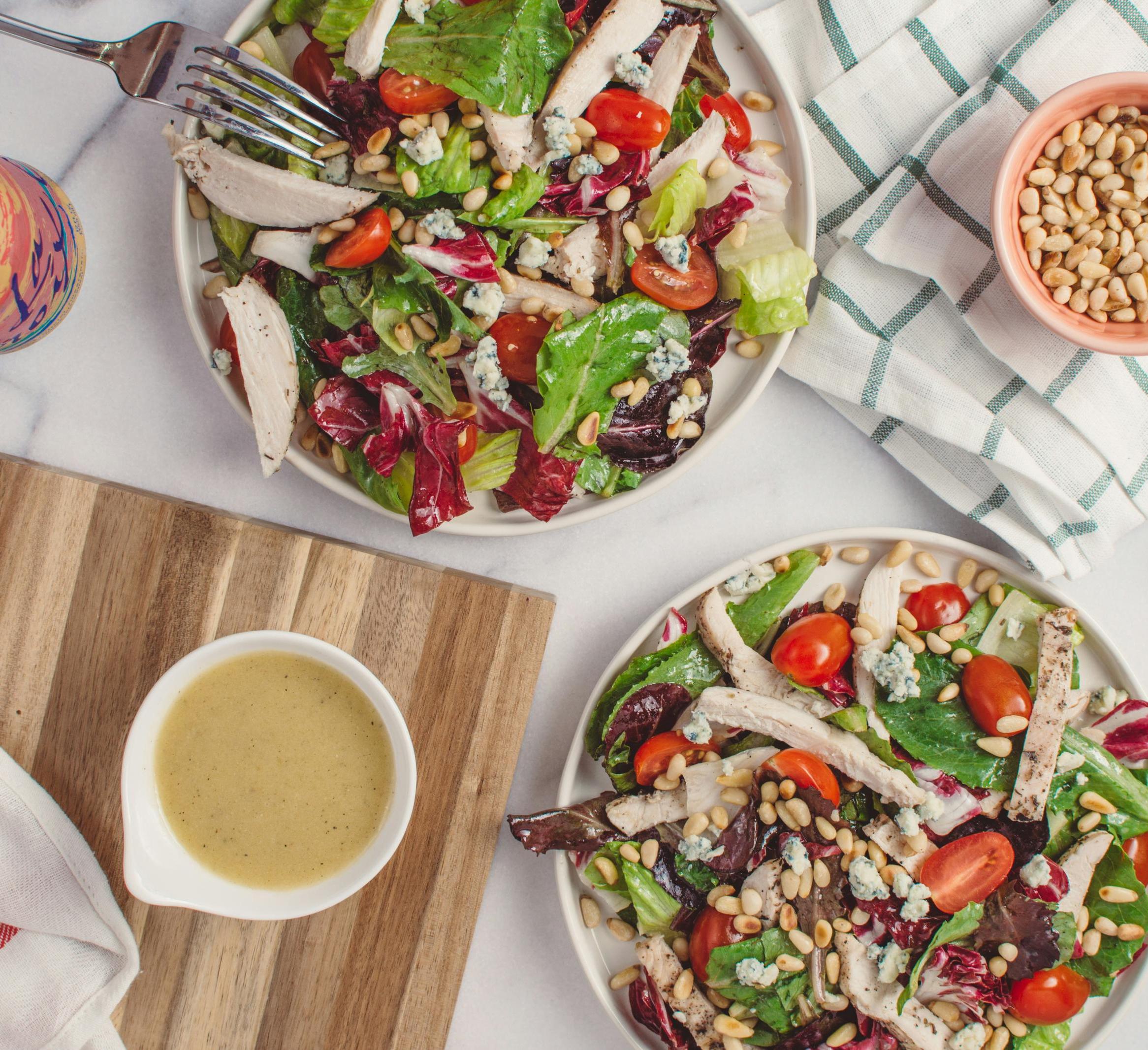 Mediterranean salad with pine nuts, vegetables and chicken