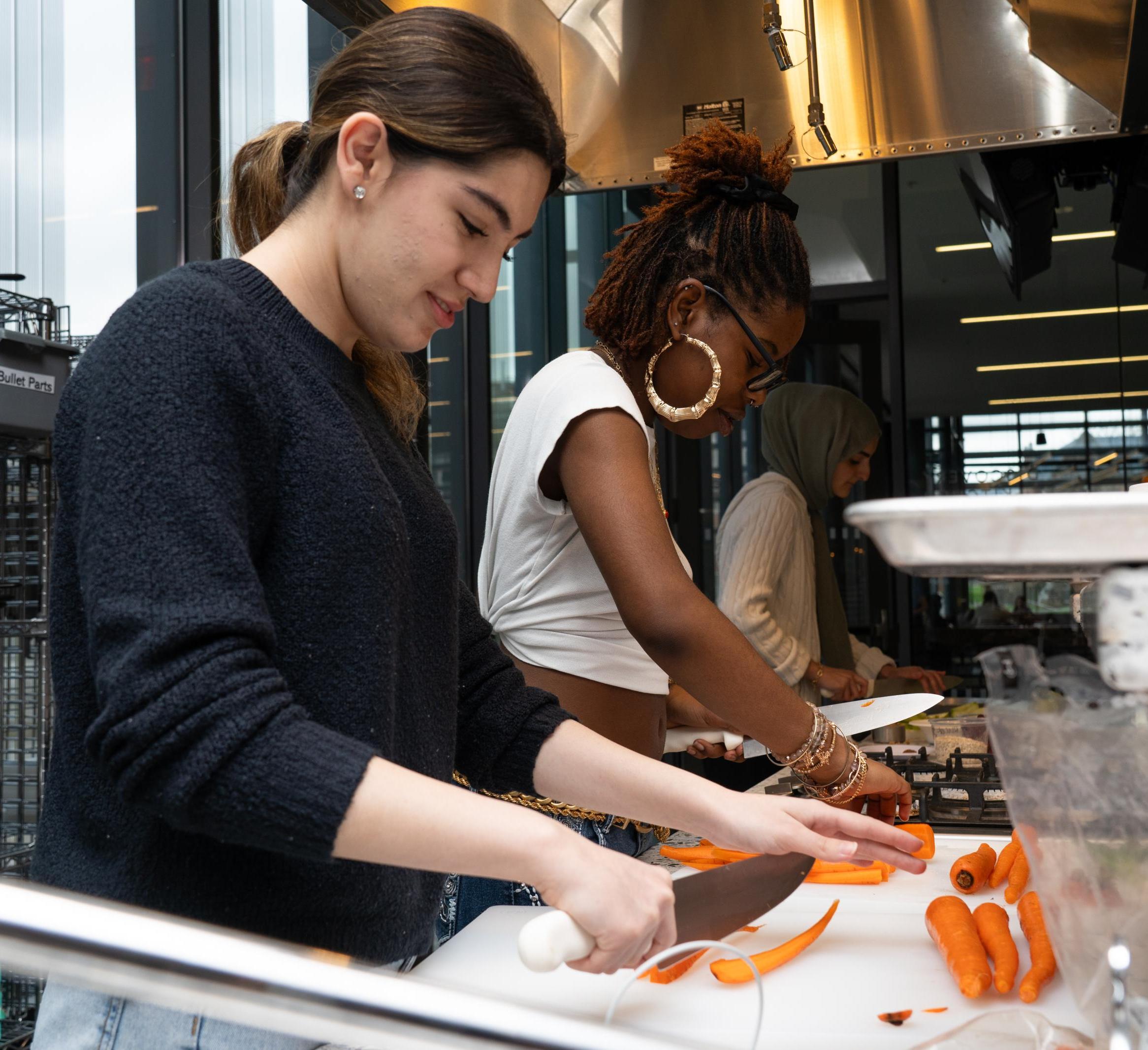 Students prepare ingredients in the Discovery Kitchen