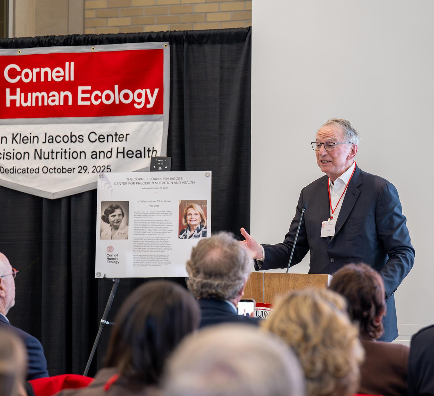 Irwin Jacobs speaks at a podium during the CPNH dedication