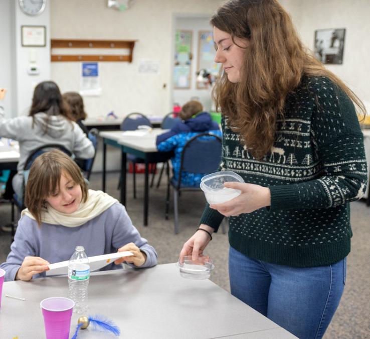 Gabrielle Dion, 4-H CARE wellness educator at Cornell Cooperative Extension Jefferson County, leads a group of students in a STEM activity