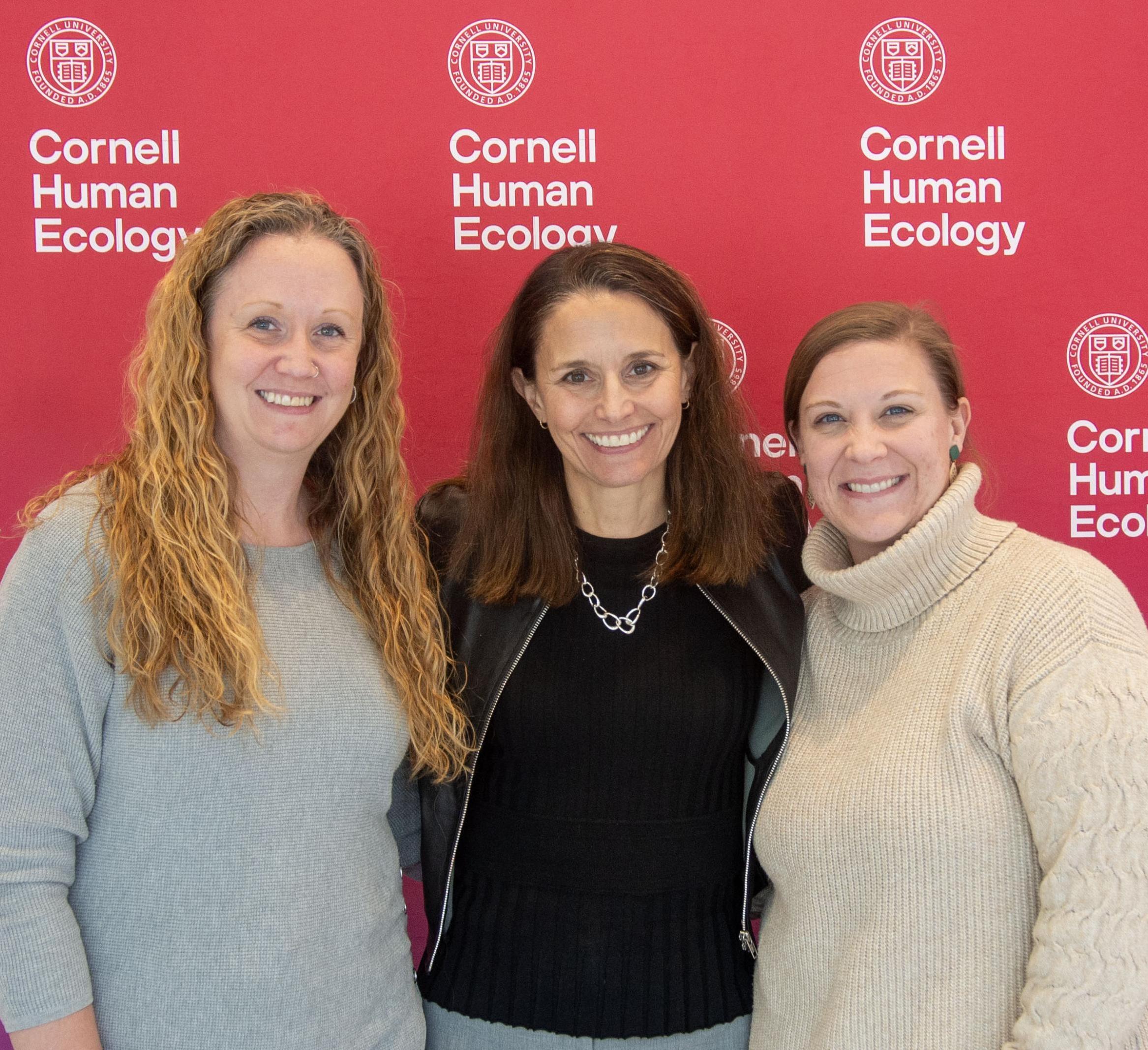 2025's two staff award winners with Dean Rachel Dunifon.