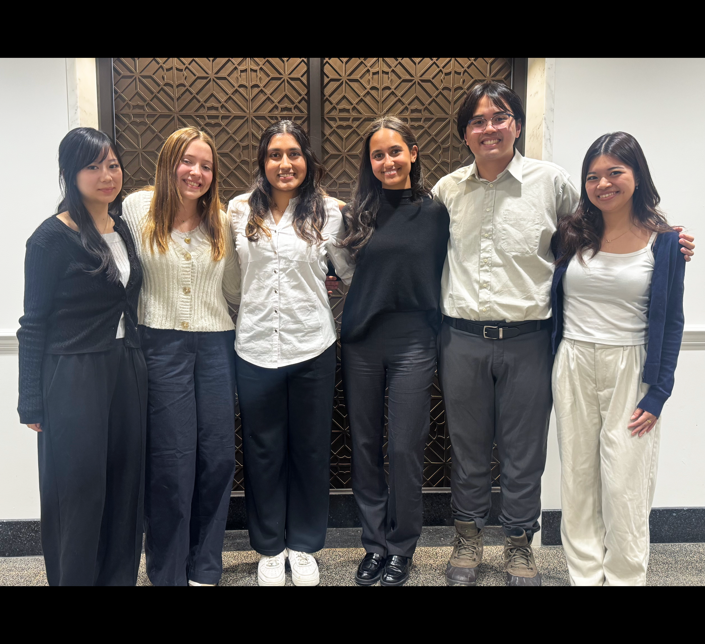 six students pose for a photo