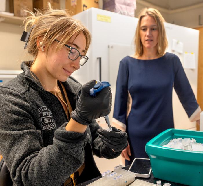 Grad student and Martha Field in lab
