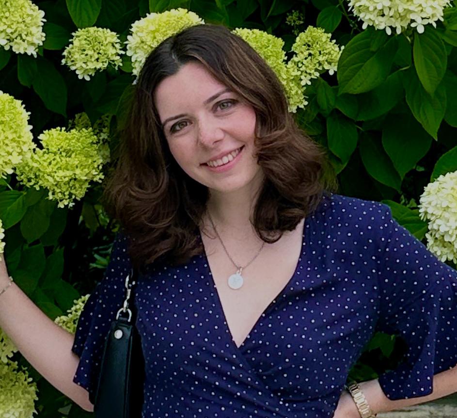 Portrait of Lauren Forstenhausler in front of green hydrangeas