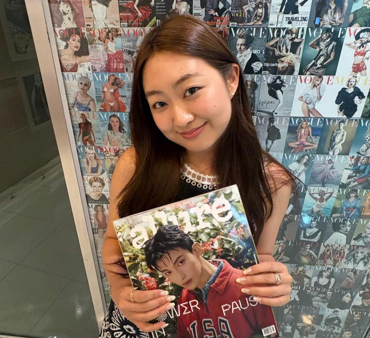 Kristen Cho poses with a magazine at Allure Korea