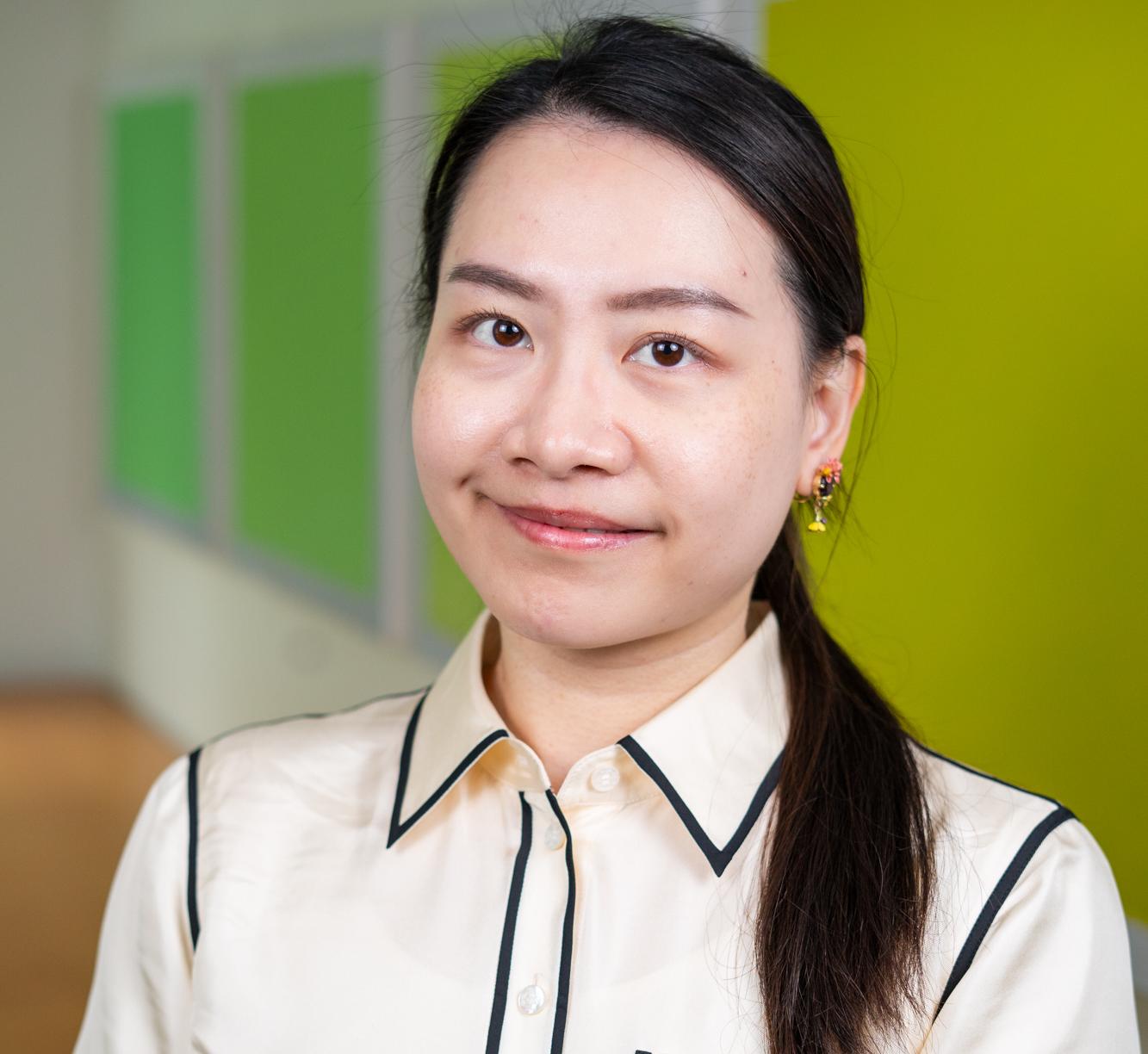 person standing in front of bright green wall panels