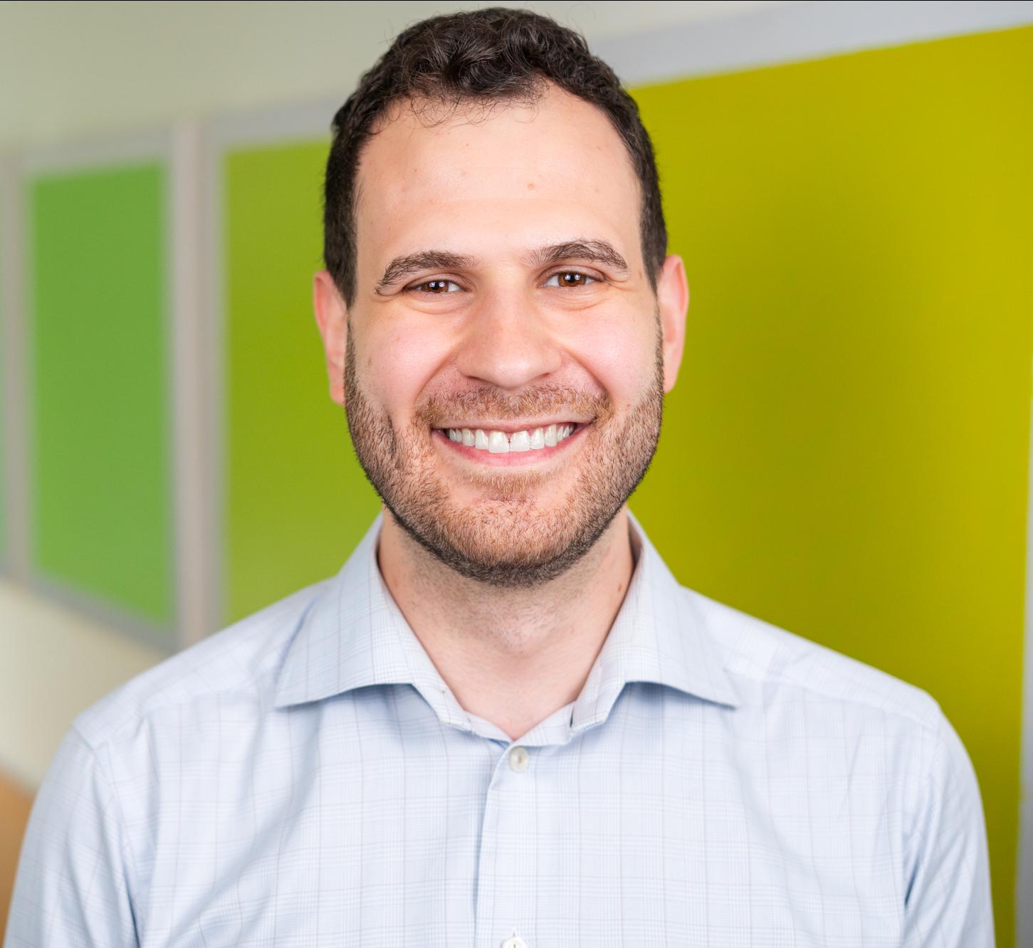 person standing in front of bright green wall panels
