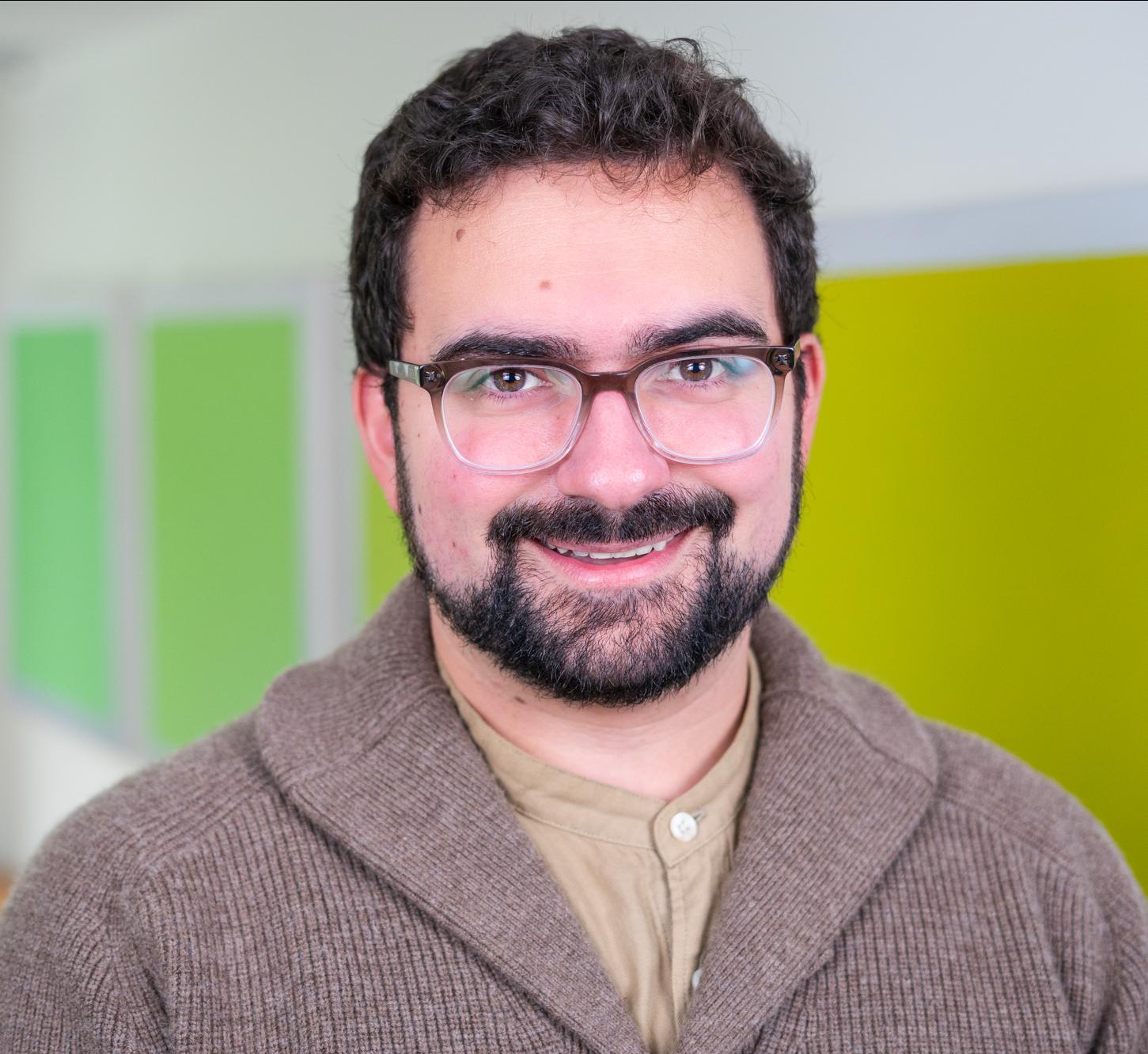 person standing in front of bright green wall panels