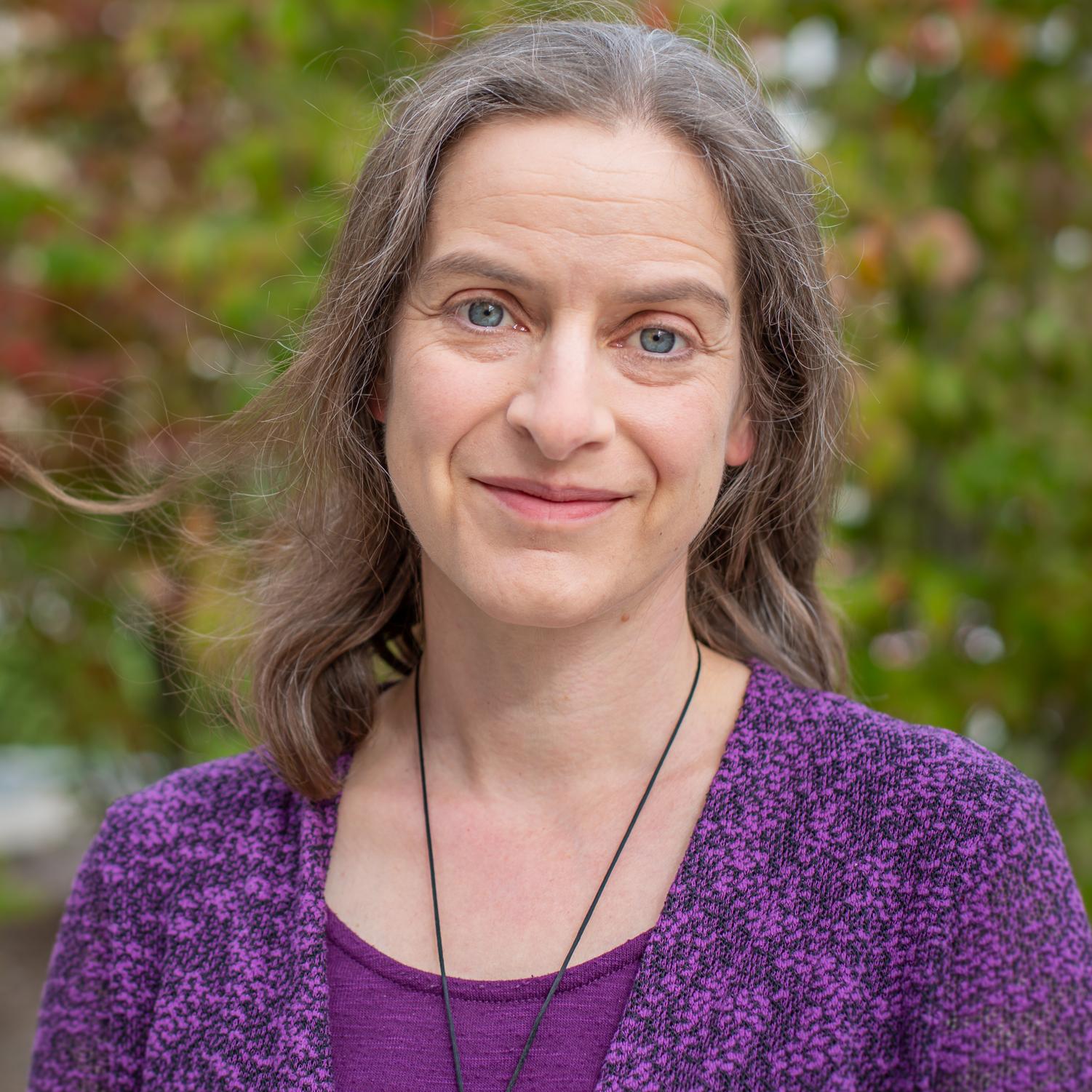 woman in a purple sweater
