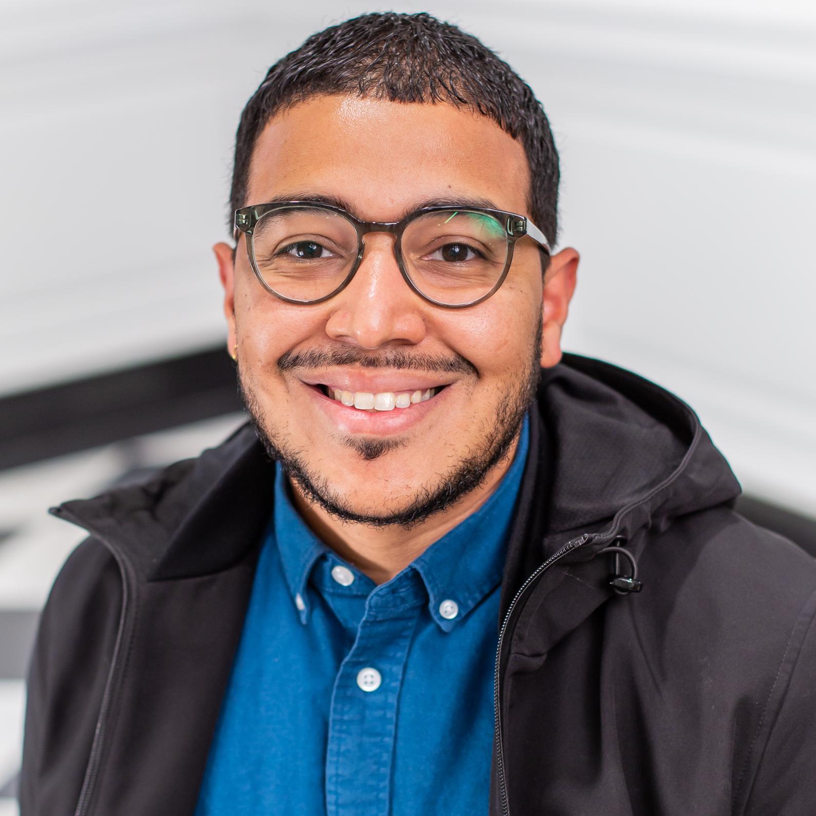 man in a blue button down shirt 