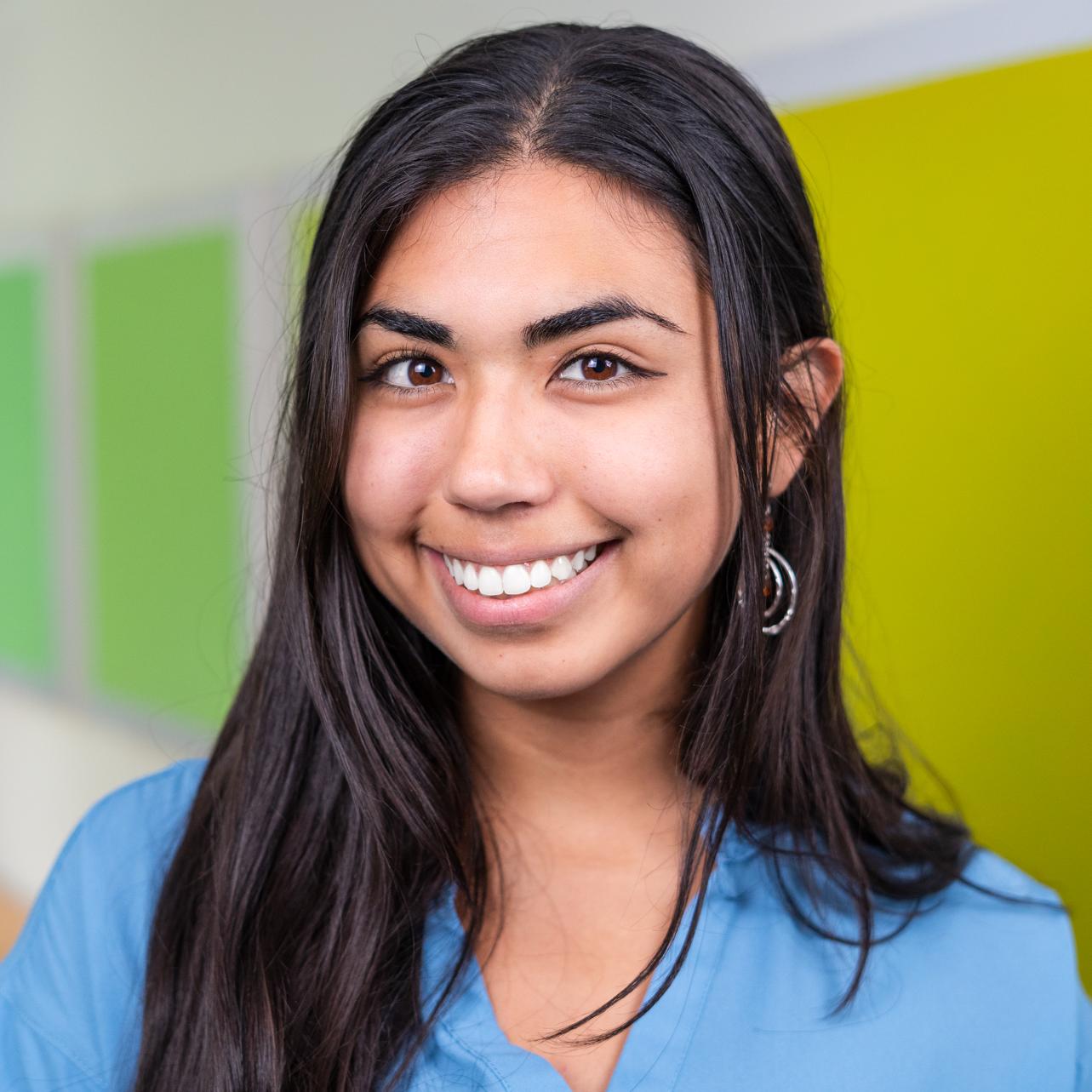 person standing in front of bright green wall panels