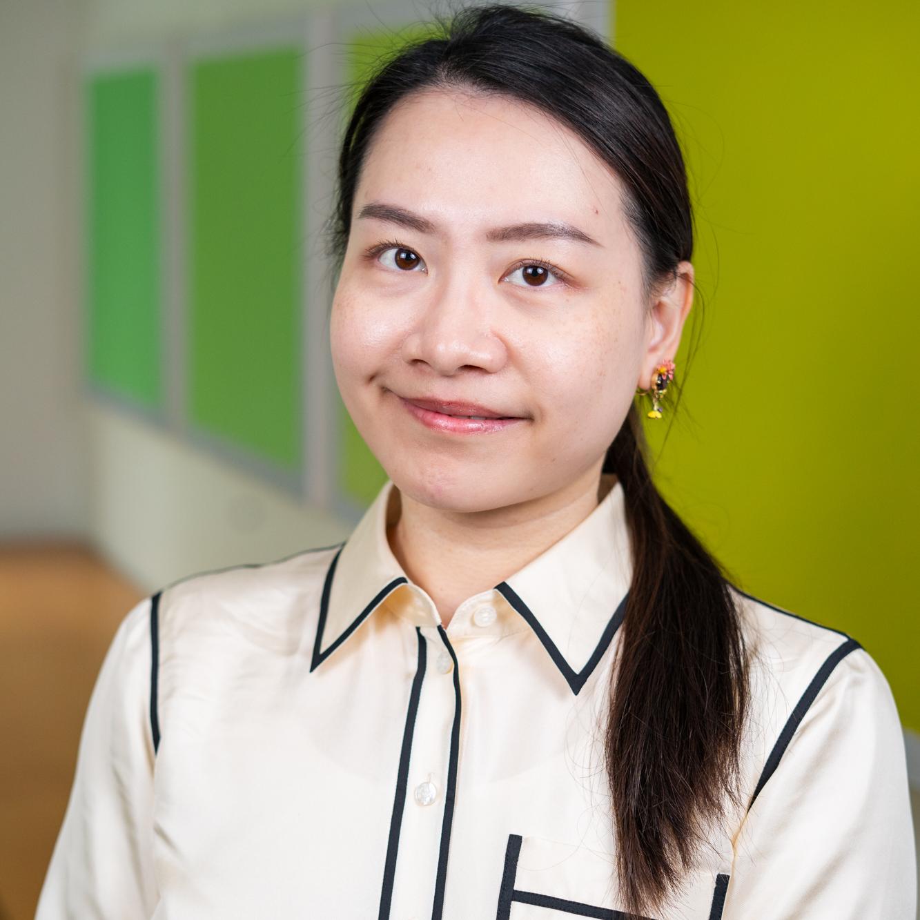 person standing in front of bright green wall panels
