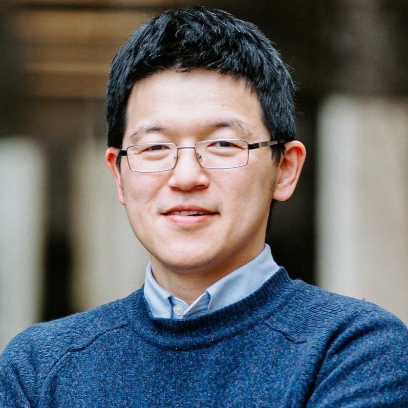 man in a blue sweater and glasses