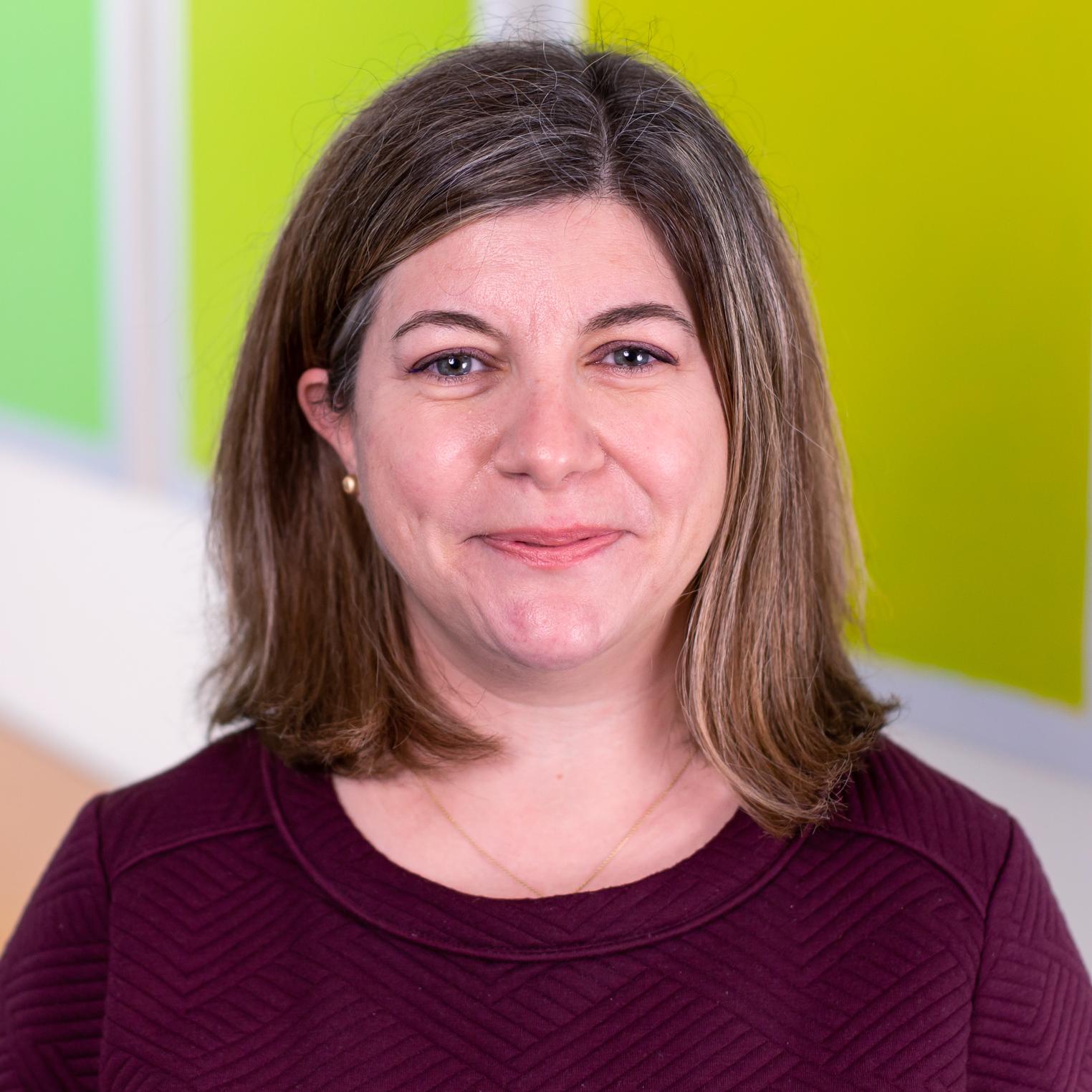 portrait of a woman in a maroon top