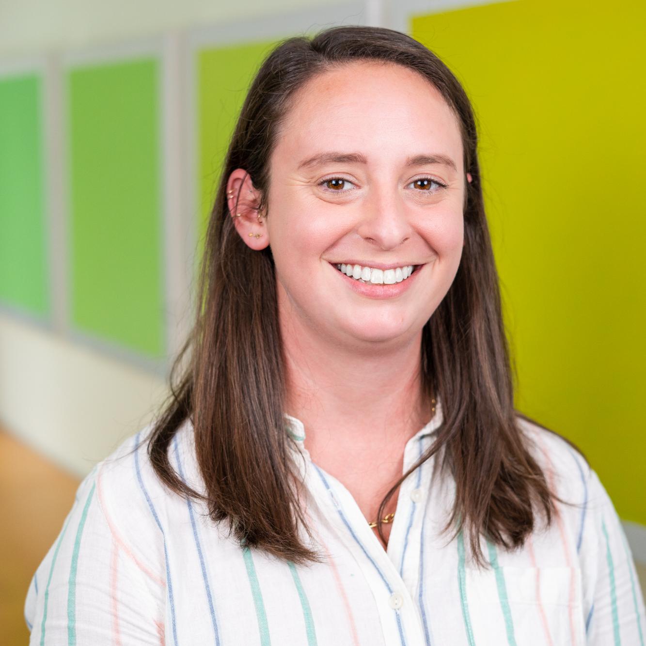 person standing in front of bright green wall panels