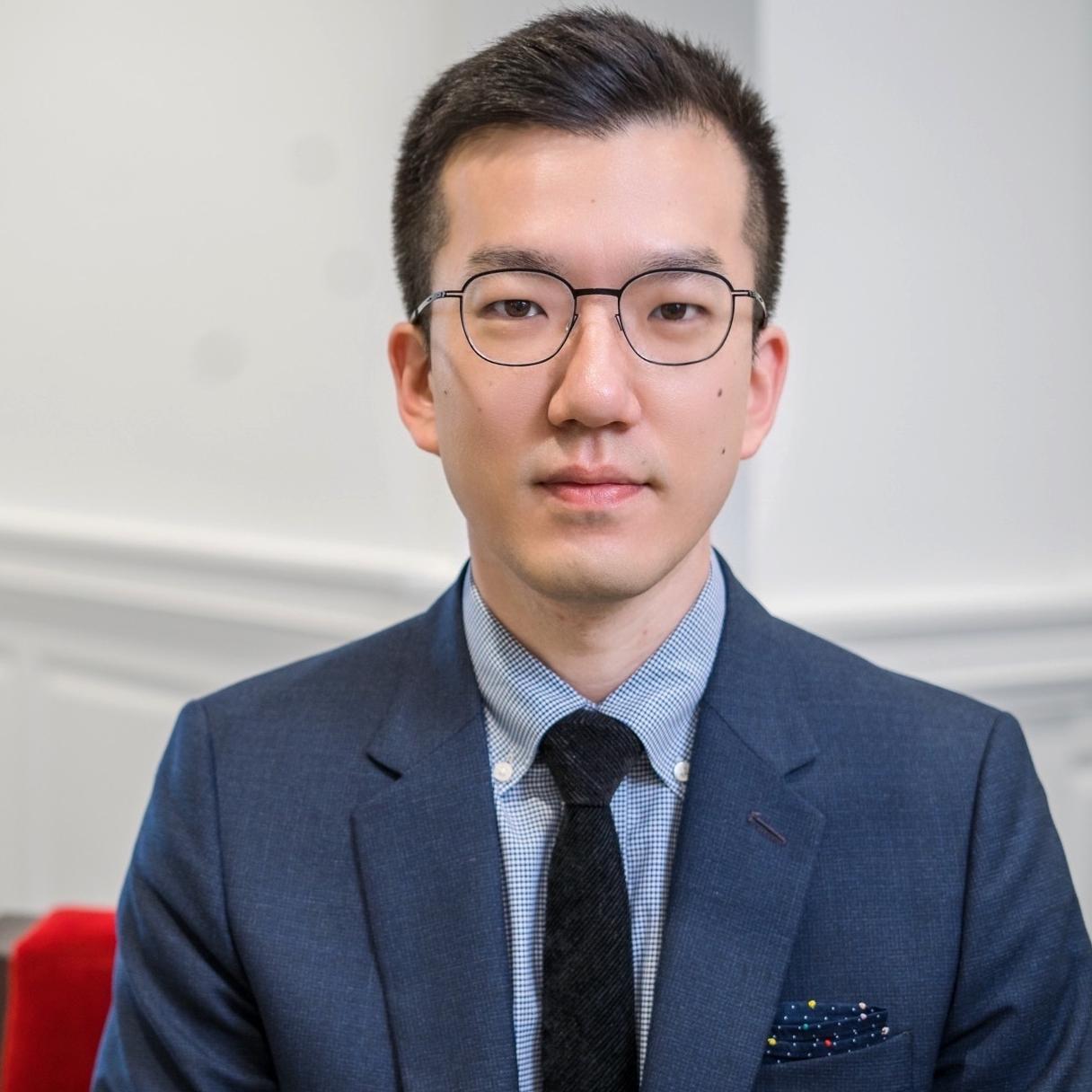 portrait of a man in a blue suit