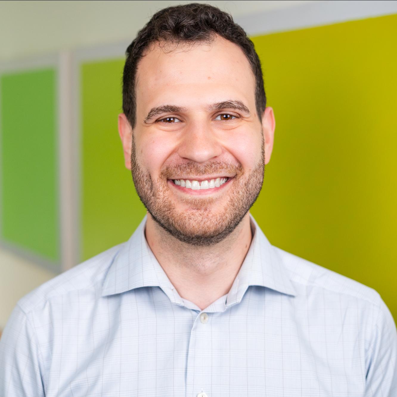 person standing in front of bright green wall panels
