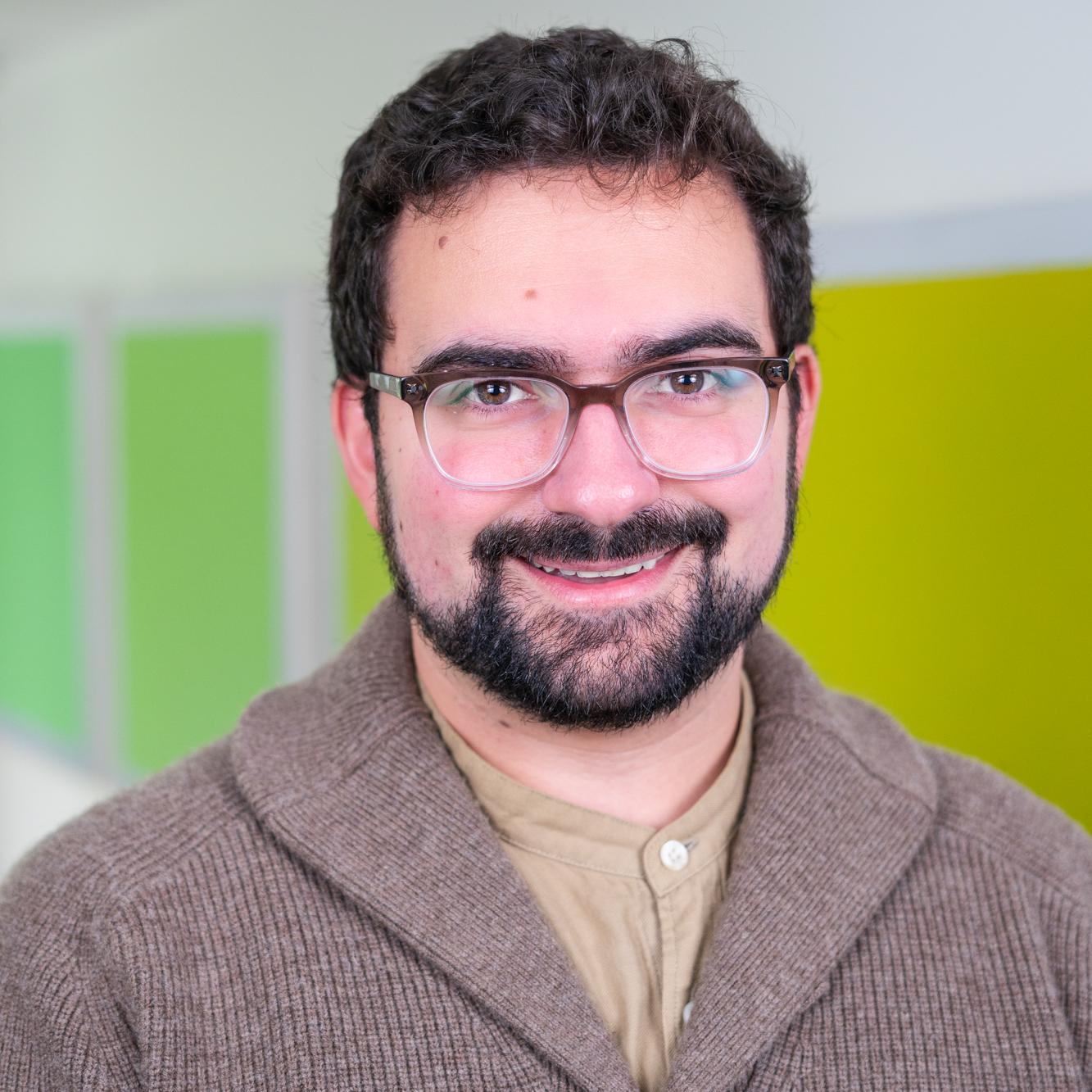 person standing in front of bright green wall panels