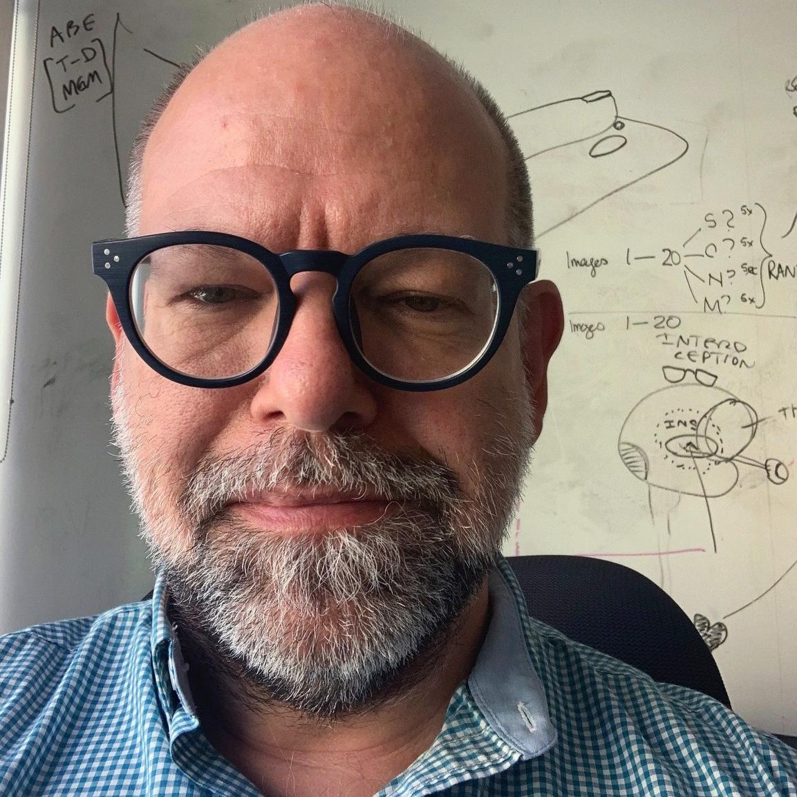 man with black framed glasses 