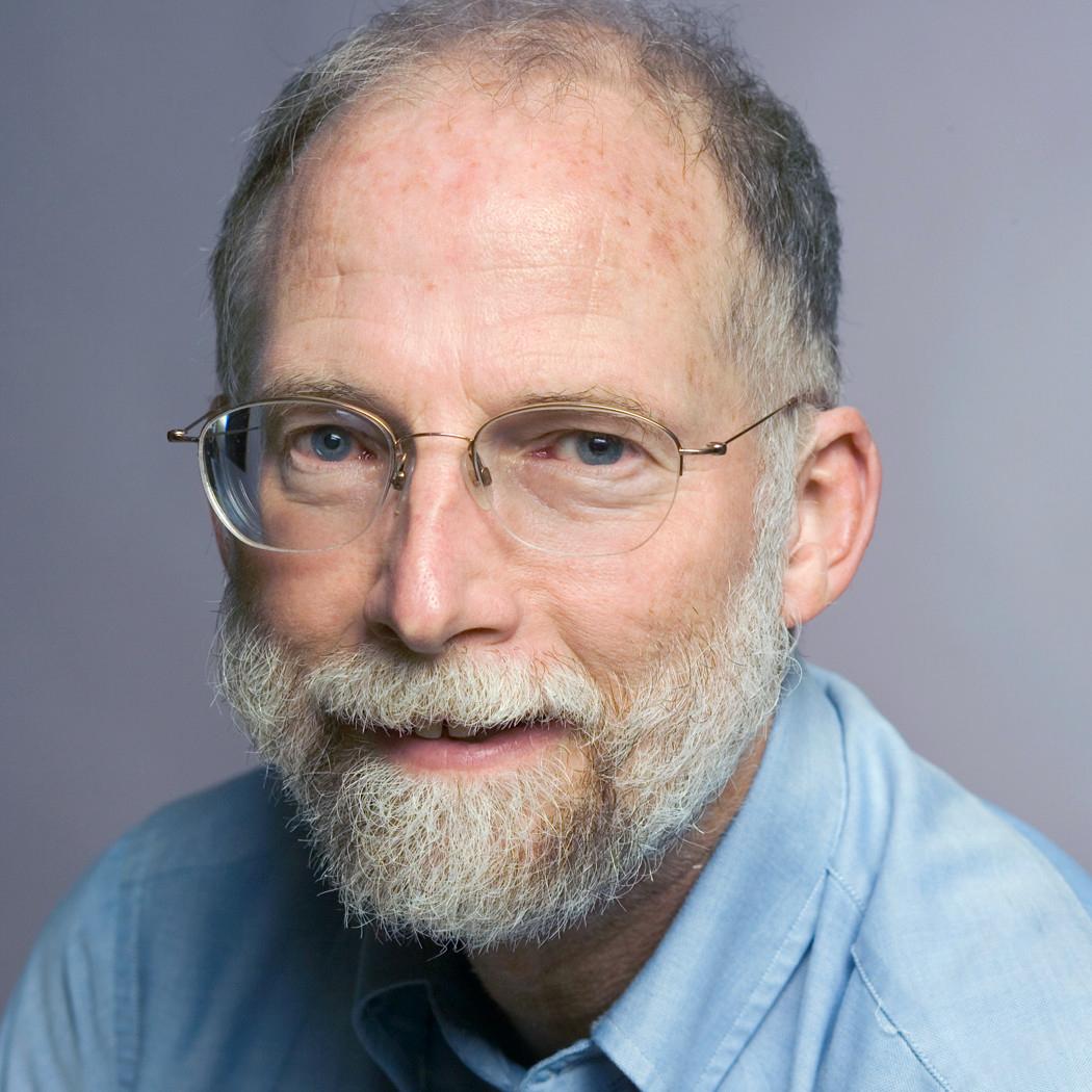 portrait of a man in a blue button down shirt