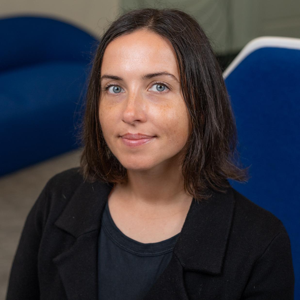 Woman sitting in a blue chair