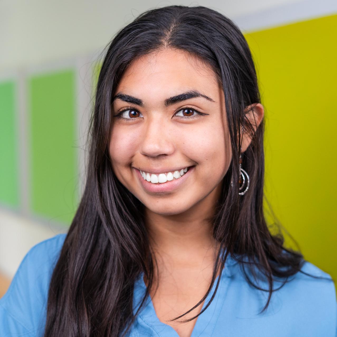 person standing in front of bright green wall panels