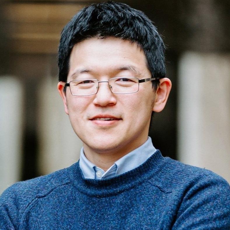 man in a blue sweater and glasses