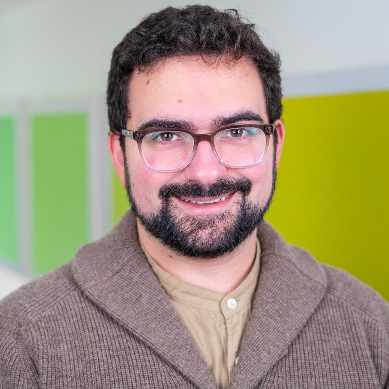 person standing in front of bright green wall panels